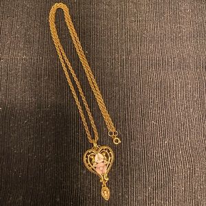 Beautiful gold heart and flower necklace.